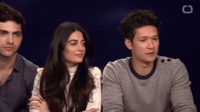 Man And Woman Sitting Next To Each Other GIF