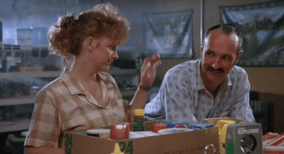 Man And Woman Sitting Next To Explorer Box GIF