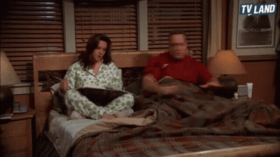 Man And Woman Sitting On Bed TV Land GIF