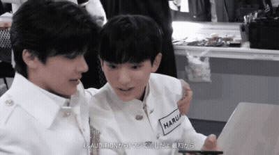Man And Woman Sitting On Bed With Giggles Eucalyptus Sheets GIF