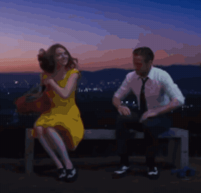 Man And Woman Sitting On Bench With City Background GIF