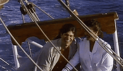 Man And Woman Sitting On Boat Smiling GIF