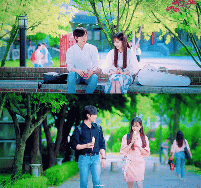 Man And Woman Sitting On Brick Wall GIF