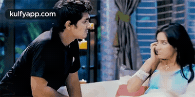 Man And Woman Sitting On Couch GIF
