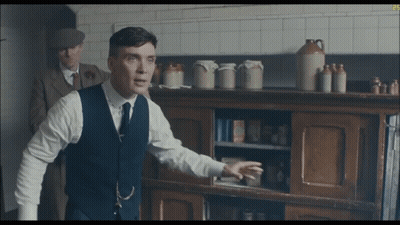 Man And Woman Sitting On Couch GIF