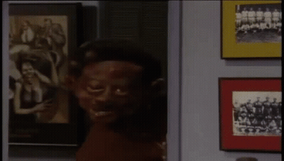 Man And Woman Sitting On Couch GIF