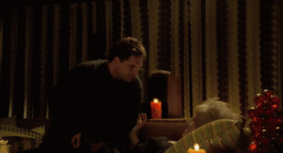 Man And Woman Sitting On Couch Leftover From Husband GIF