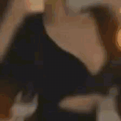 Man And Woman Sitting On Couch Looking At Each Other GIF