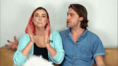 Man And Woman Sitting On Couch Pink Hair GIF