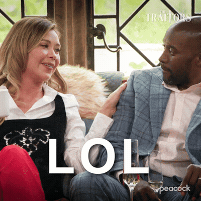 Man And Woman Sitting On Couch Saying LOL GIF