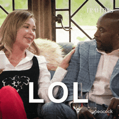Man And Woman Sitting On Couch Saying LOL GIF