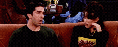 Man And Woman Sitting On Couch Saying Oh GIF