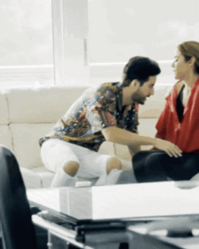 Man And Woman Sitting On Couch Talking GIF