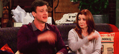 Man And Woman Sitting On Couch With 500Kg Pillow GIF