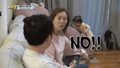 Man And Woman Sitting On Couch Woman Saying No GIF