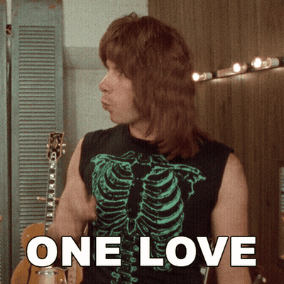 Man And Woman Sitting On Couch GIF