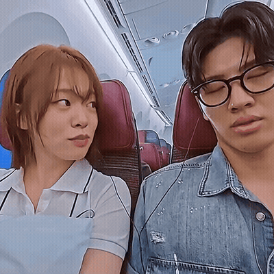 Man and Woman Sitting on Plane