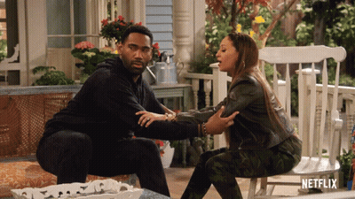 Man And Woman Sitting On Porch With Netflix Logo GIF
