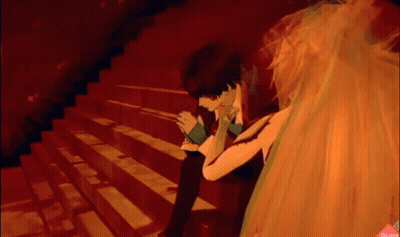 Man And Woman Sitting On Stairs In Dark Room GIF