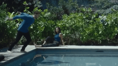 Man And Woman Sitting Pool Edge GIF