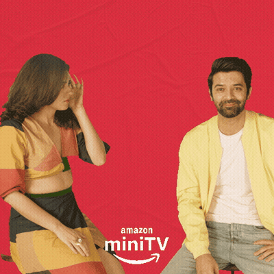 Man And Woman Sitting Red Background Amazon MiniTV GIF