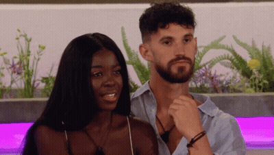 Man And Woman Sitting Smiling GIF