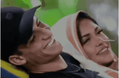 Man And Woman Sitting Smiling Woman Wearing Hijab GIF
