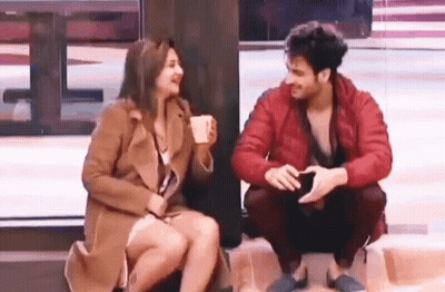 Man And Woman Sitting Together GIF