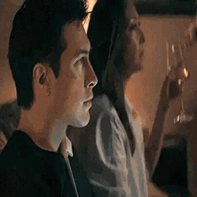 Man And Woman Sitting Together In Dark Room GIF