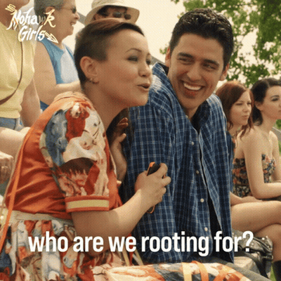 Man And Woman Sitting Together Who Are We Rooting For GIF