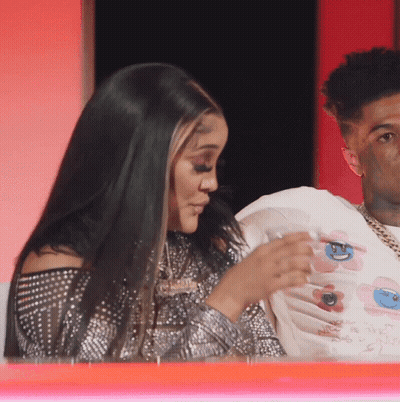 Man And Woman Sitting Together Woman In Floral White Shirt GIF