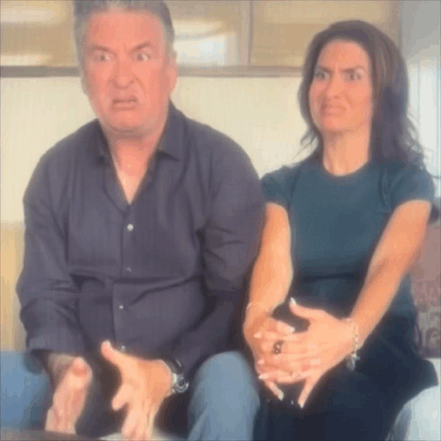 Man And Woman Sitting Together Woman Making Funny Face GIF