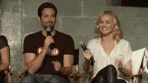 Man And Woman Sitting With Microphones GIF