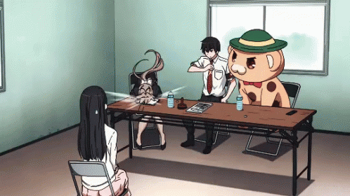 Man And Woman Sitting With Stuffed Animal In Green Hat GIF