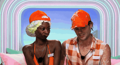 Man And Woman Sitting, Woman In Bathing Cap GIF
