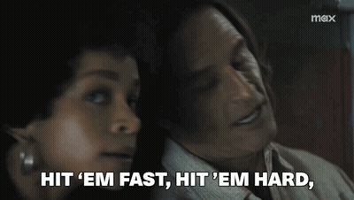 Man And Woman Sitting Woman Saying Hit Em Fast Hit Em Hard GIF