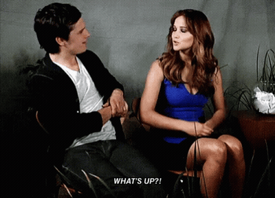 Man And Woman Sitting Woman Saying What's Up GIF