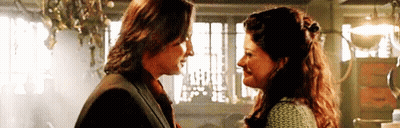 Man And Woman Smiling At Each Other GIF