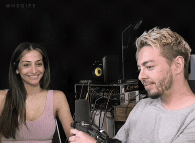 Man And Woman Smiling At Microphone Saying H3GIFs GIF