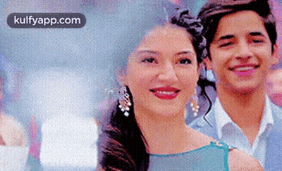 Man And Woman Smiling For Photo GIF