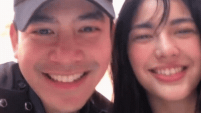 Man And Woman Smiling For Photo GIF