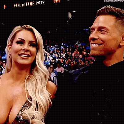 Man And Woman Smiling In Crowd GIF