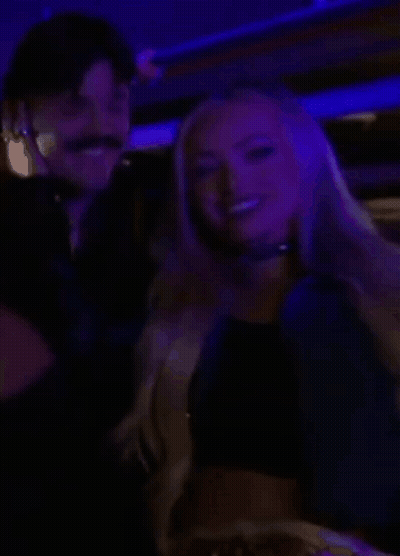 Man And Woman Smiling In Dark Room GIF