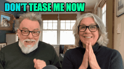 Man And Woman Smiling In Front Of Don't Tease Me Now Sign GIF