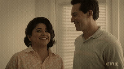 Man And Woman Smiling In Front Of Netflix Window GIF