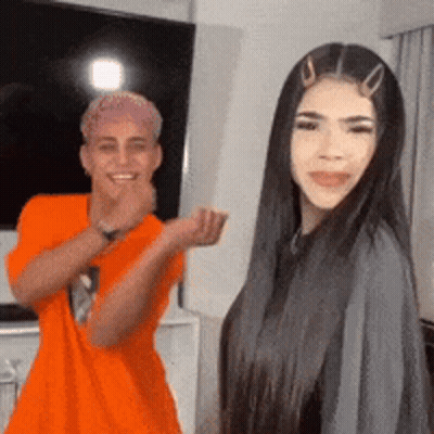 Man And Woman Smiling In Living Room GIF