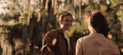 Man And Woman Smiling In Park GIF