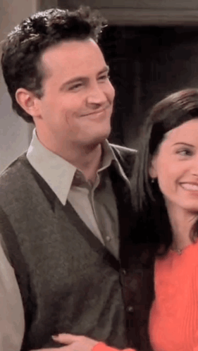 Man And Woman Smiling Next To Each Other GIF