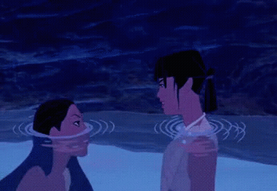 Man And Woman Splashing Each Other In Water GIF