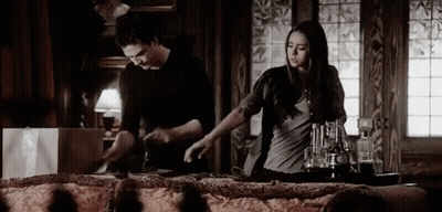 Man And Woman Standing At Table GIF
